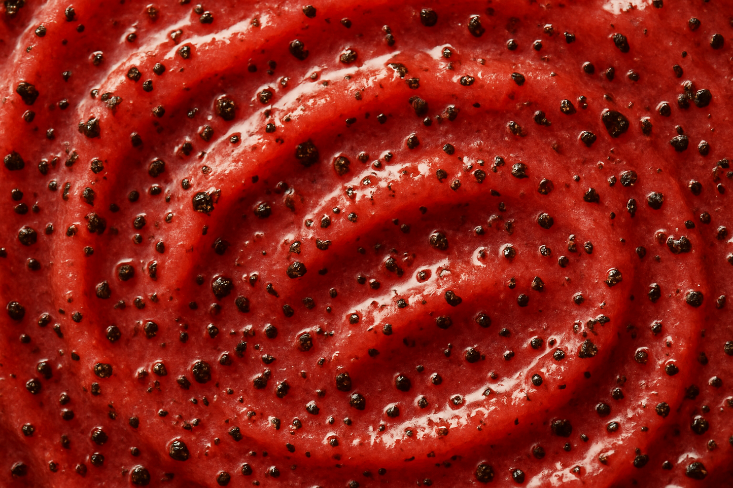 give me a close up swatch of a body scrub red with coffee ground in it 